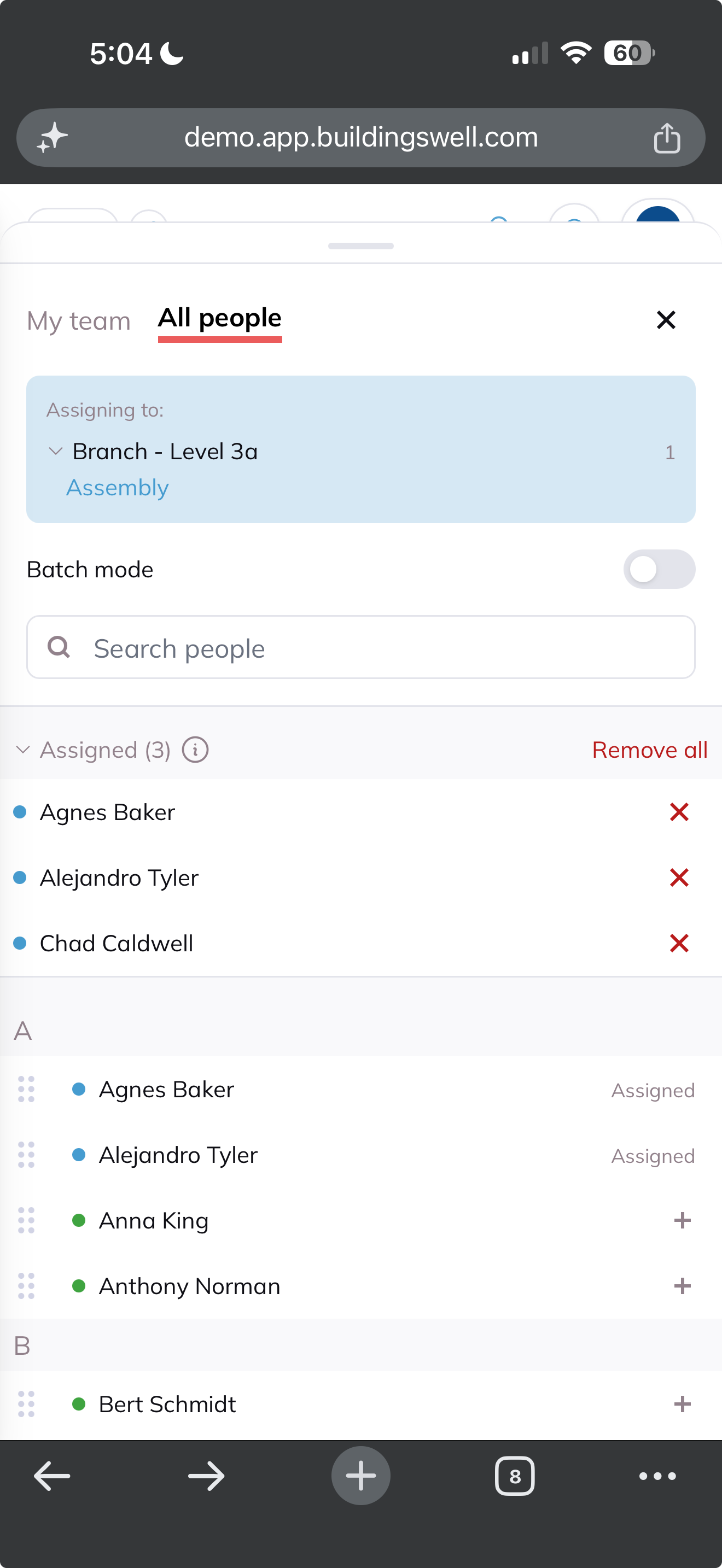 The assignment tray with three people added under Assigned, each with a remove button beside a Remove all link.